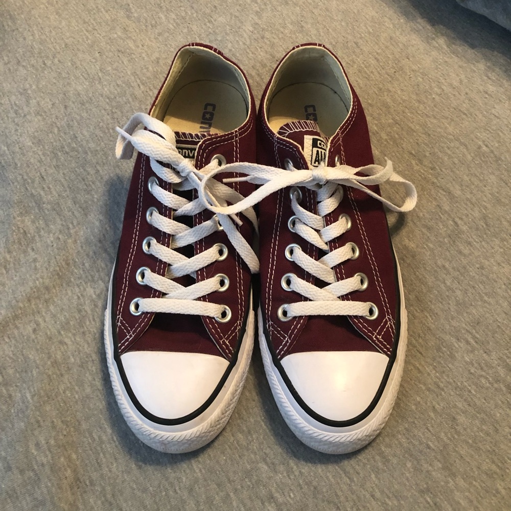 Burgundy low-top converse